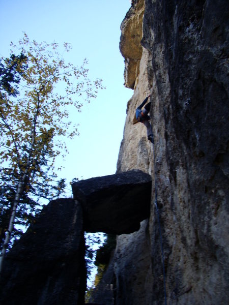 Going up and over the chockstone and heading left to a wild fingercrack. Red Point achieved with some mild pain involved.