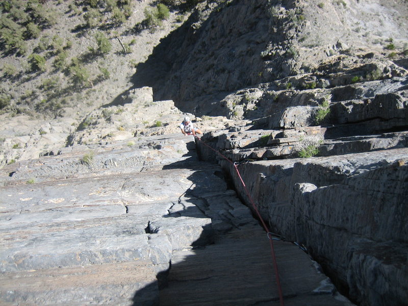 Matt Culberson (Resident Notch Peak Expert) finishing up the Godsend Crack.  Which is 5.10 by the way 