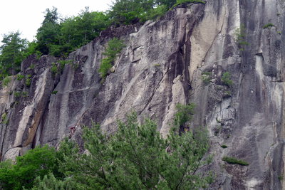 2 climbers (left) on what seems to be the ledge where the double pins are