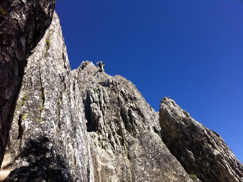 Pitch 6 from alternate pitch 5. Pitch 5 - two right facing ramps.  This is the left of the two ending at at a big tree.  The 6th pitch arete is easily accessable from here.  The notch at lower right is where the other pitch 5 ends.