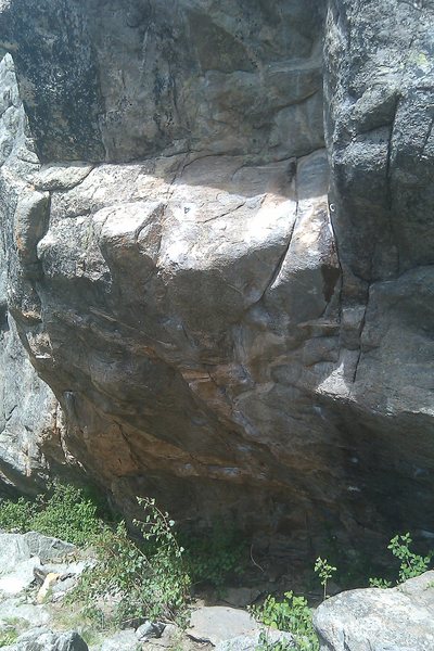 Brenda from Kansas ascends the center of the steep overhang and continues past the ledge.  