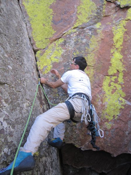 Tony B on the crux opening moves on the FA of 'Everybody Has An Opinion' (5.8). Photo by Micah Salazar, 6/2011.