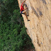 Steep, boulder problem start Raising Awareness (5.12).