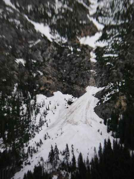 Sandy access ledges can be seen ~150 feet left of drainage. Follow these up and Left to access the fixed ropes (hand lines). On the ridge ~200-300 feet above the hand lines is where the route begins.