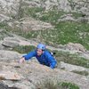 Josh traversing right on pitch 3 to get to the flake after the roof.