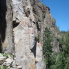 Rudyard Kipling is the obvious thin hands crack on the main face of the tower. Move up and right from the ledge to clip a bolt, then traverse into the crack. 