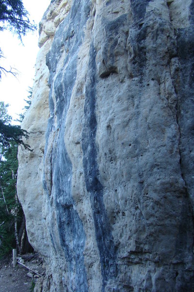 The right hand most side of The Court House Wall. This area is nice and shady first thing in the morning. From right to left; The crack climb is a 5.11c, the blonde area contains a 5.12c/d known as The Baliff, followed by Juvenile, 5.12a (dark black streak) and Faith a very difficult climb that clocks in at 5.12+/5.13-. After that the lumpy, blonde butress has even more difficult climbs that also rate around 5.12+/5.13-.