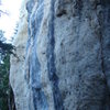 The right hand most side of The Court House Wall. This area is nice and shady first thing in the morning. From right to left; The crack climb is a 5.11c, the blonde area contains a 5.12c/d known as The Baliff, followed by Juvenile, 5.12a (dark black streak) and Faith a very difficult climb that clocks in at 5.12+/5.13-. After that the lumpy, blonde butress has even more difficult climbs that also rate around 5.12+/5.13-.