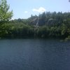 View of the cliff from across the pond.The tiny white spec in the water (left center) is a guy in a float.