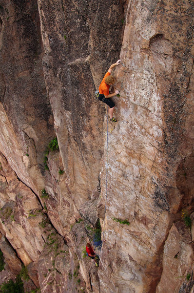 Bob Kryzer holding on to the arete on Swizzlestick Legs. 