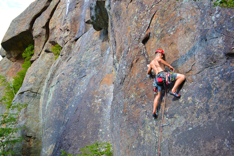 Scott Arno moves with determination on the direct start (5.10b) to "Rule of the Bone" (5.10c - Barkeater Cliff - Adirondacks, NY)