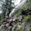 "Two Ears" starts next to the pine tree in this photo which is growing right next to Weller Slab beneath (maybe 12' left) the Zanzibar Dihedral.  