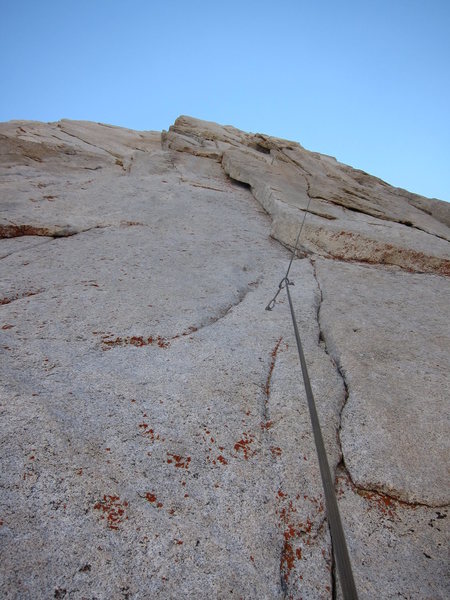 Looking up at the crux 3rd pitch. You can see both the crux seam and the thin dihedral.