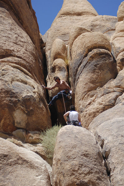 finishing the easy chimney on an indian cove climb