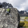 Bouldering in Tonquin Valley, Ramparts in the background.