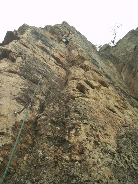 Just below the crux.  One or two more bolts to the anchor.