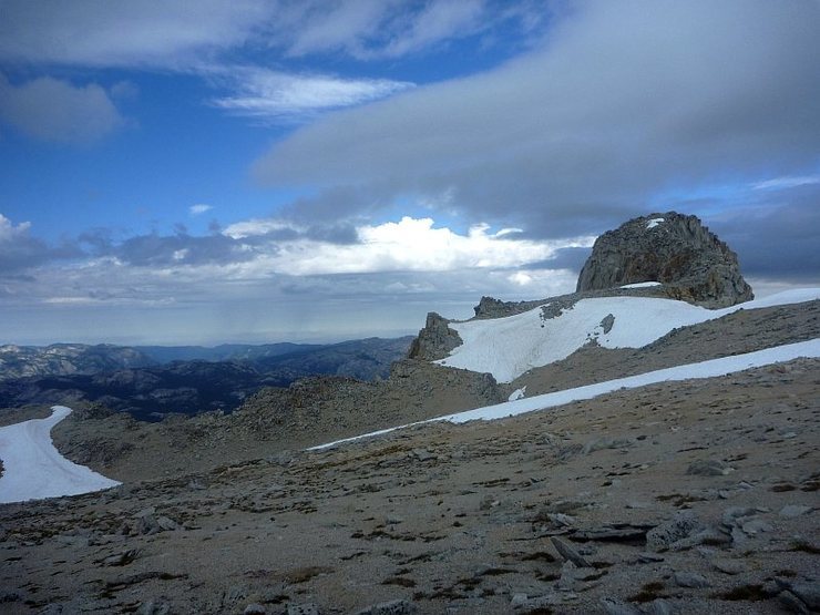 First view of the Conness summit on the right once topping out past the notch onto the sandy plateau. 26 Aug 2011.