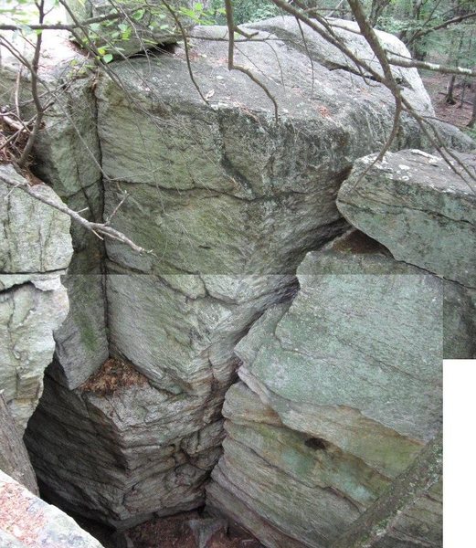 View of the pit's south wall (which faces north...let's call it the front side).  Arete-in-a-Hole on the left, Wide Crack on the right.