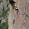 Nat finishing up the airy traverse on pitch 4.