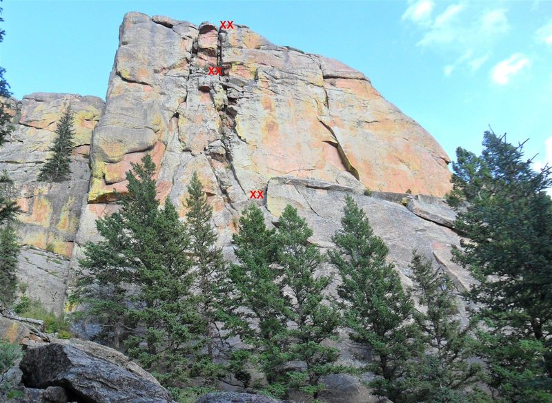 Belay station anchor locations on Chickenhead, as seen when traversing across the talus field nearing the Headstone.