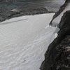 Telephoto view  from (summit ridge) of climber stymied at Gooseneck Bergschrund. 