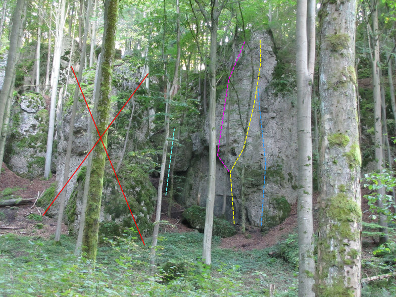 Don't climb on the rock with the big X on it. <br>
Cyan is Rolling Stone (8). Pink is Abitour (6). Yellow is Trabant (5+) and blue is Konrad Oed Gedenkweg (5).