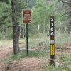 When you see this sign, turn right, step over the cables, and find the old trail.
<br>

<br>
EDIT 8/2019: these signs have been removed, but the cables are still there.