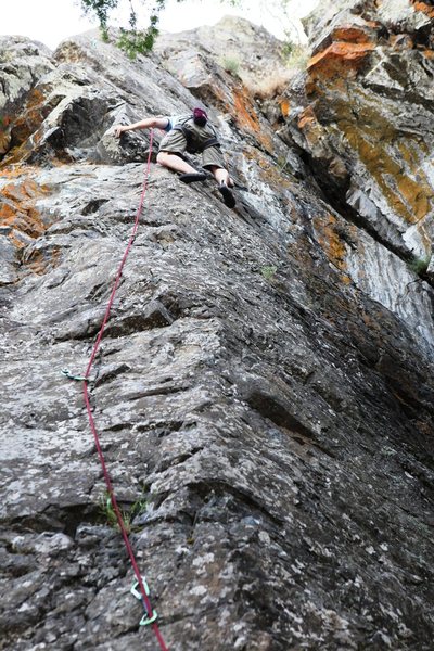 Tim getting to grips with the crux on The Voices Told Me, 5.9