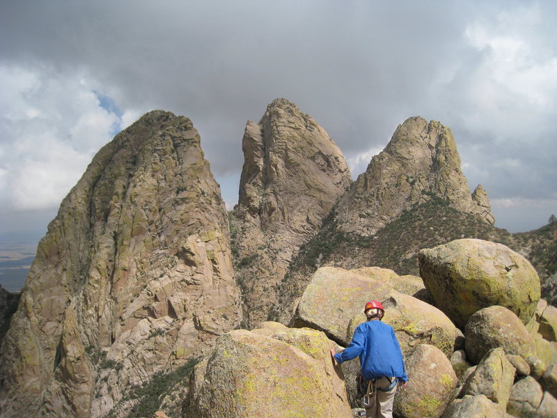 Marta getting ready to scramble down from the summit of ORP with the Rabbit Ears standing majestically in the background. 