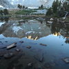 A reflection of the North Buttress, Mt Goode in Margaret Lake