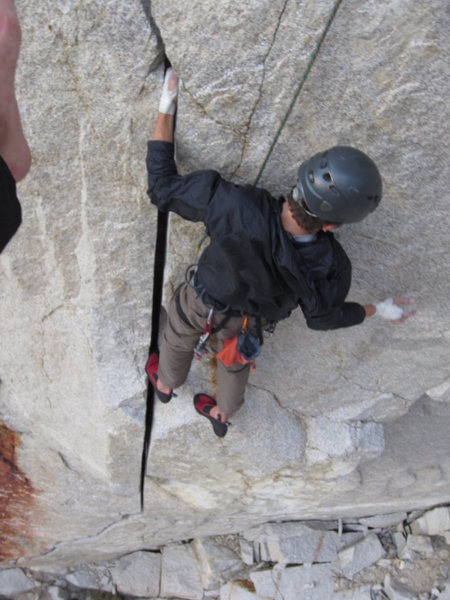 Garrett at the good rest after the green-red camalot crux. 