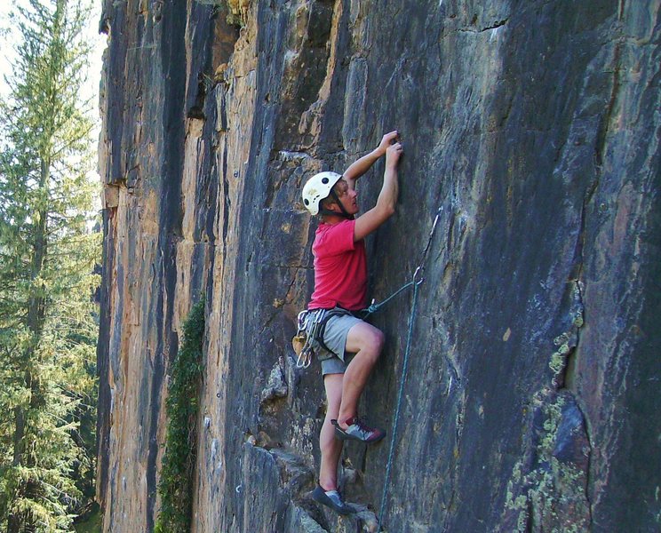 Triston scouting the crux.