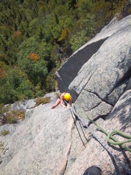 Melissa Feldmann works her way around the classic second overhang on P3(5.7) of Quadrophenia, Hurricane Crag, Adirondacks, NY