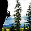 Jason continuing up the arete.  Toner Mountain in the background.  (I & Eye, 5.11+)