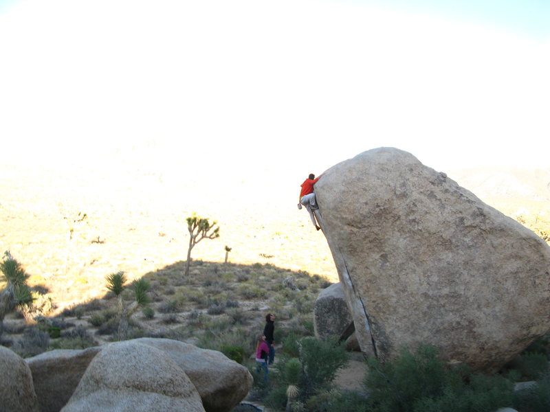 white rastafarian V3R.  mantling 20 feet directly above a back-breaker block about 6 feet wide.  