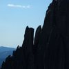 Climbers, I think they were on the shoulder of Eyetooth.  Eyetooth is hard to see in this shot, it's sort of eclipsed by (in front of) East Gruesome.  Taken from the Sickle.  