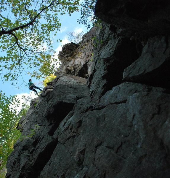 Tammy rapping off F.o.F.  <br>
<br>
Climb starts at the obvious broken face in pic, climb to roof, traverses roof to the left, then follow obvious cracks to tree and ledge. 