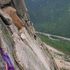 Belay above the Triangular roof, looking down with climbers on Vertigo