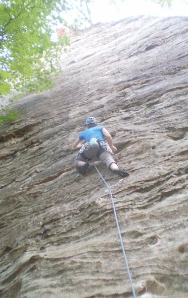 Mary getting into the steep iron oxide rails that make this route so much fun.