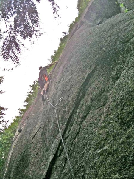 Just finishing the crux section on 900 Oil-stricken Waterfowl Taken to Ocean Shores, 5.11a.