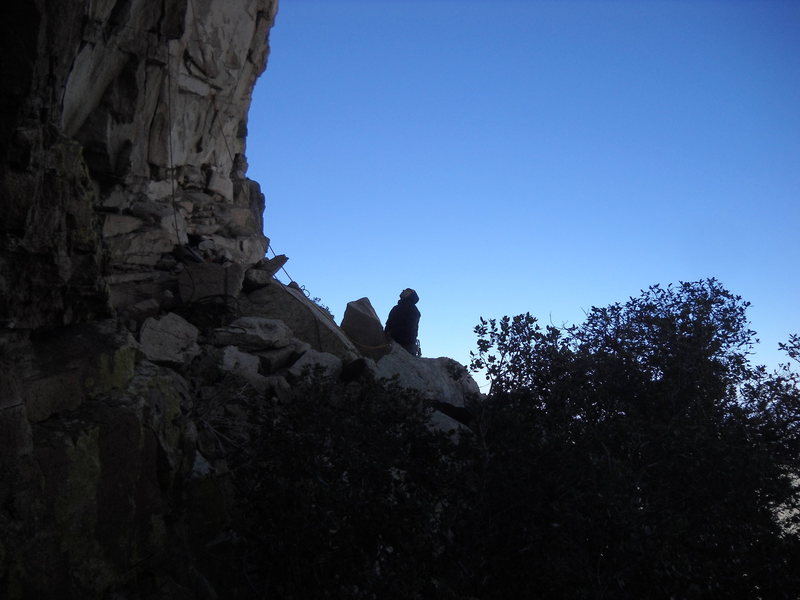 Belayer on duty at the base of Ma'adim on a very cold day