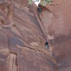 Belaying belaying below the last bolt, Mike Keegan leading the dihedral