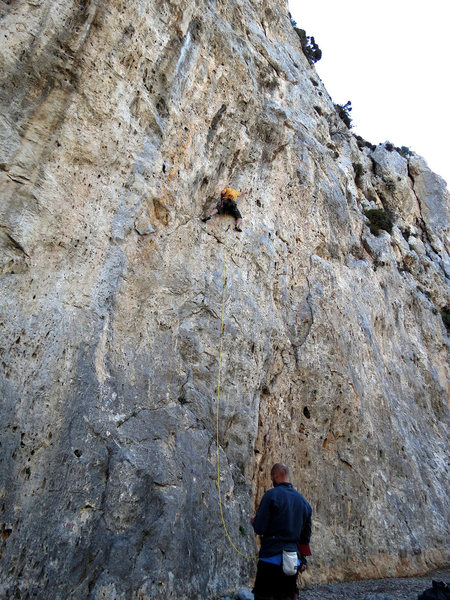 Your Top Rope Hero cruxing out on greasy phantom edges high above his last clip...his partner Sean asleep at the belay.