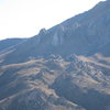 Heller Rocks (the small formations in a row near the center of the photo), seen from across the valley.  Once a drive-up, you now must hike quite far for the climbs on these rocks