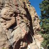 The bottom of Mr. Hanky, 5.10a.  The hardest moves are on the headwall above the roof in the middle of the picture.<br>
<br>
Climber: K. Decker.