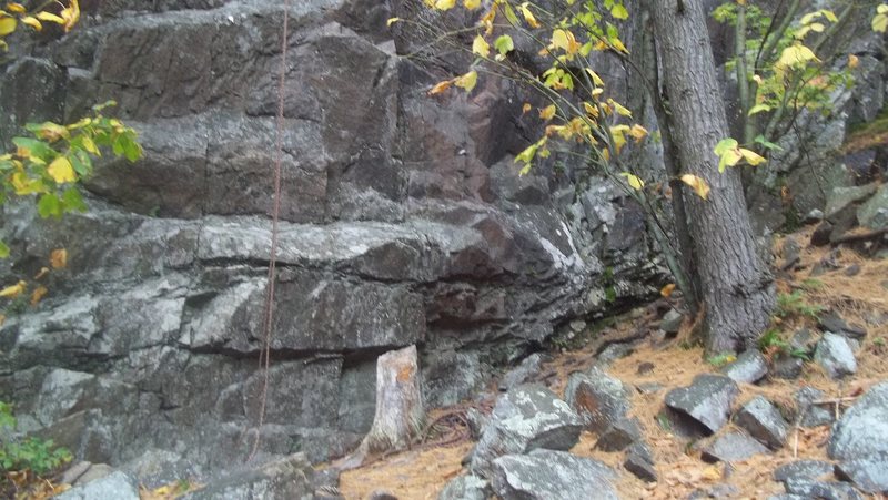 Base of Former Rock Star (known by some as J&R),    the central gully is just to the left of pic. Climb is slightly left of the rope.