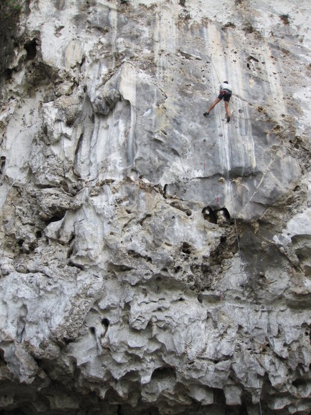 Kapur Chimney is on the left side of this photo. The climber is resting on Simtoi (5.12a).