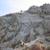 Looking up to the fore-shortened slab at the start of the route (photo by Phil Ashton)