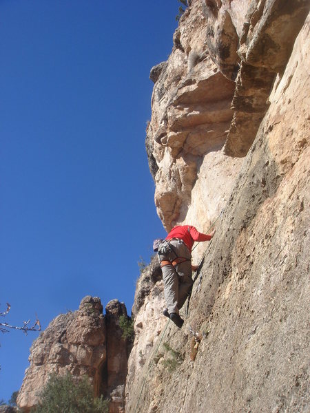 Traversing away from the third clip before heading up to the anchor.