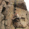 I guess this is off route but, anyway, This is the first crux where the feet are just smearing where you have to traverse right for a move before stemming back across the crack (as in photo) for a good rest higher up. I didn't move right initially and went too far up the crack and got ejected coming around to the right.